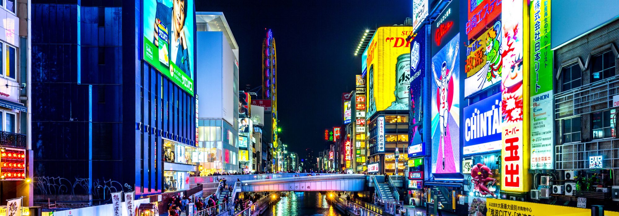 OSAKA, JAPAN - FEB 15, 2018 : Tourist walking in night shopping street at Dotonbori in Osaka, Japan  on February 15,2018